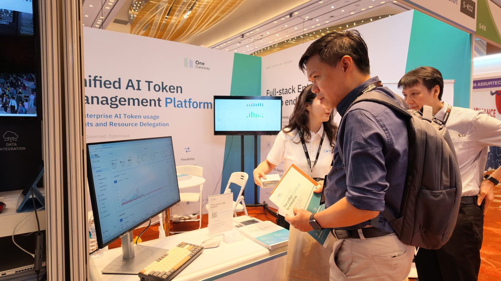 Visitors at the OneGateway demo station, Booth 5-K12, Tech Week Singapore 2026